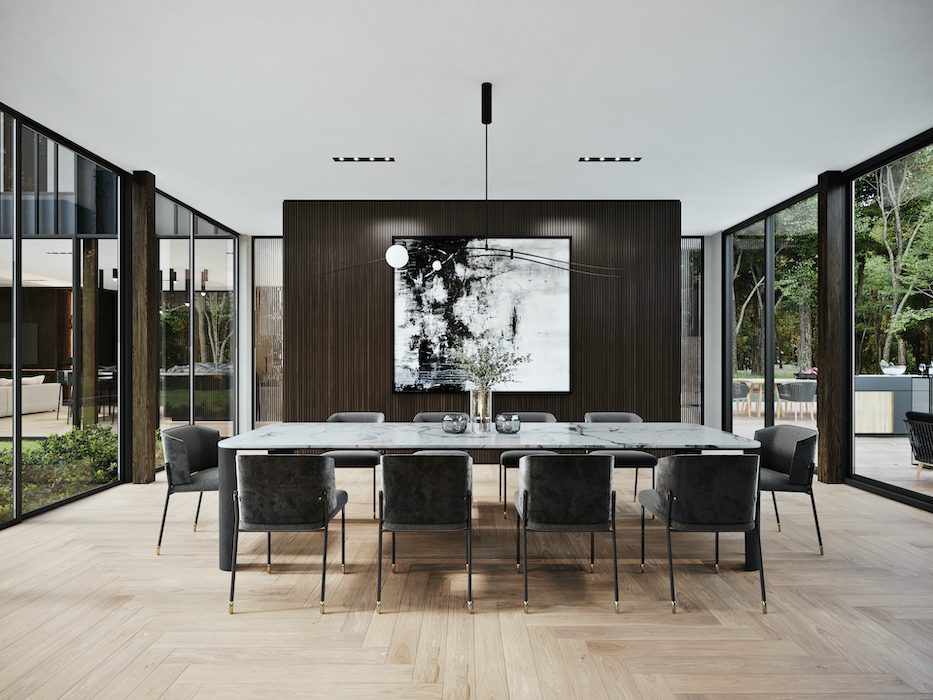 A modern dining room with wooden floors and large windows.