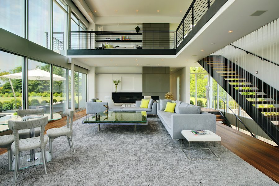 A living room with a staircase.