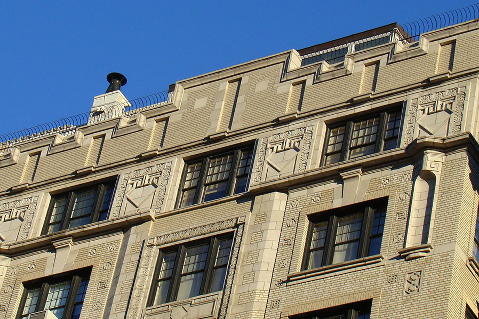 A clock on the top of a building.