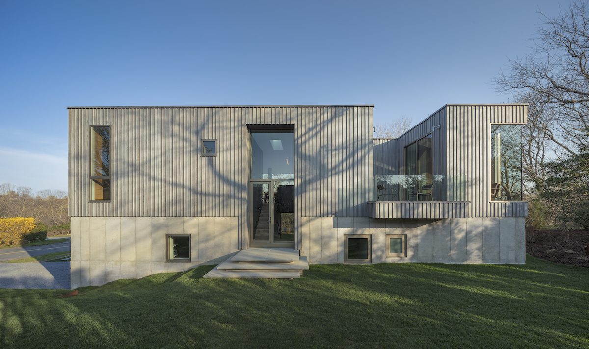 A modern house with a concrete exterior.