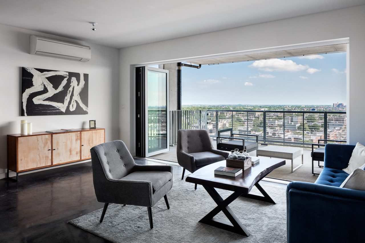 A living room with a view of the city.