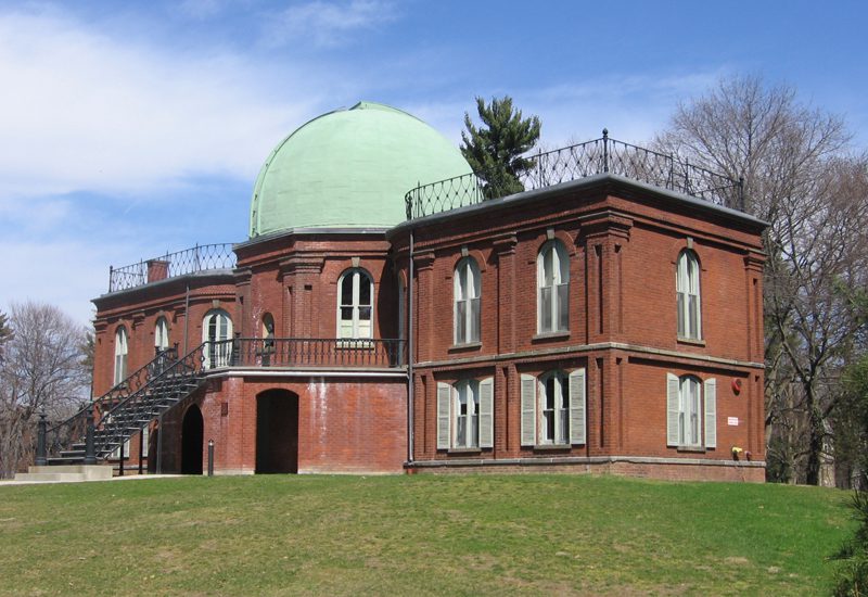 A brick building with a dome.