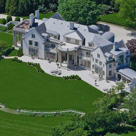 An aerial view of a large mansion.
