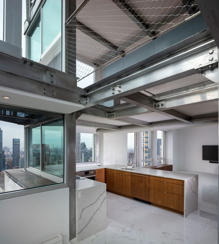 An open kitchen with a view of the city.