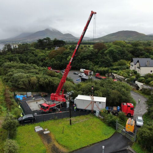 An aerial view of a crane on a construction site.