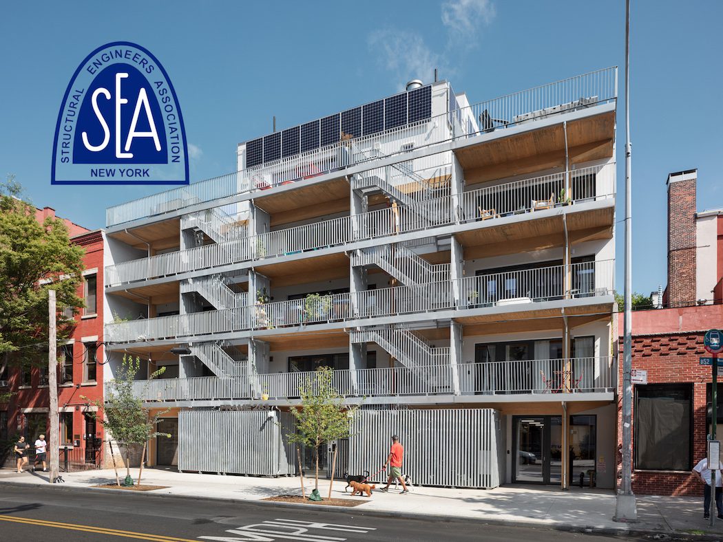 A new multi-family residential building design, featuring the iconic "saa" letters on its façade.